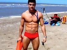 Hunk boys with big muscles posing topless at the beach